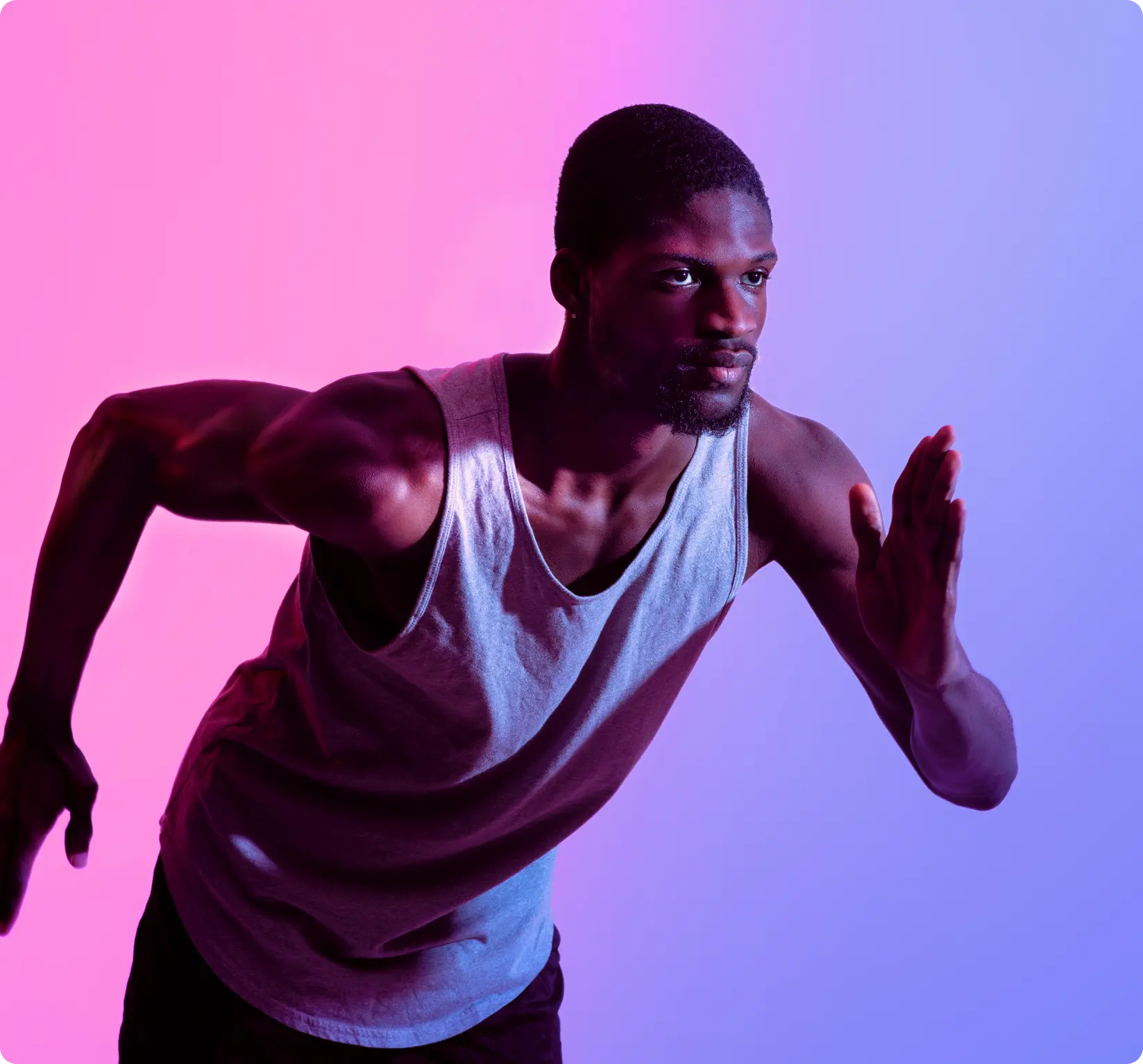 Young African American man wearing a tank top in a running position